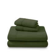 Polar fleece sheets and pillowcases folded and stacked on a white background