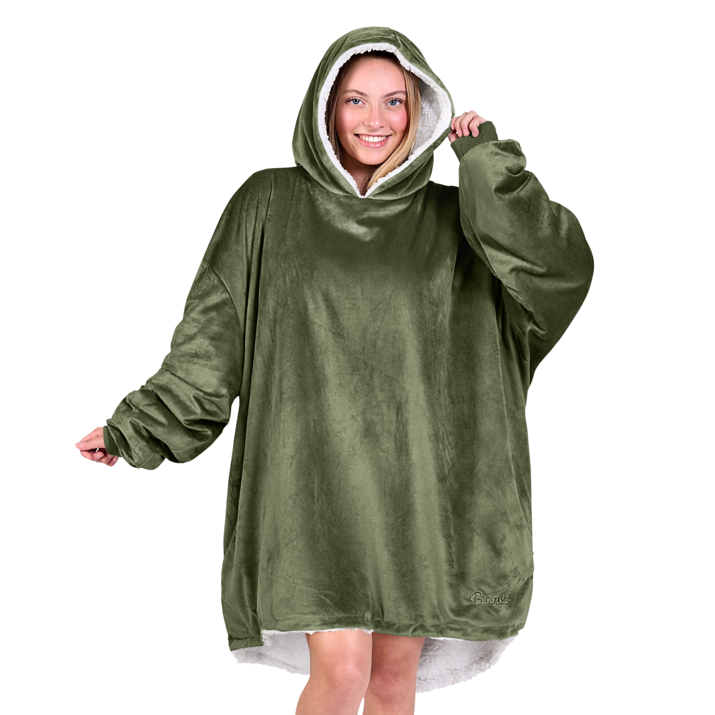 An adult with a sherpa wearable blanket on