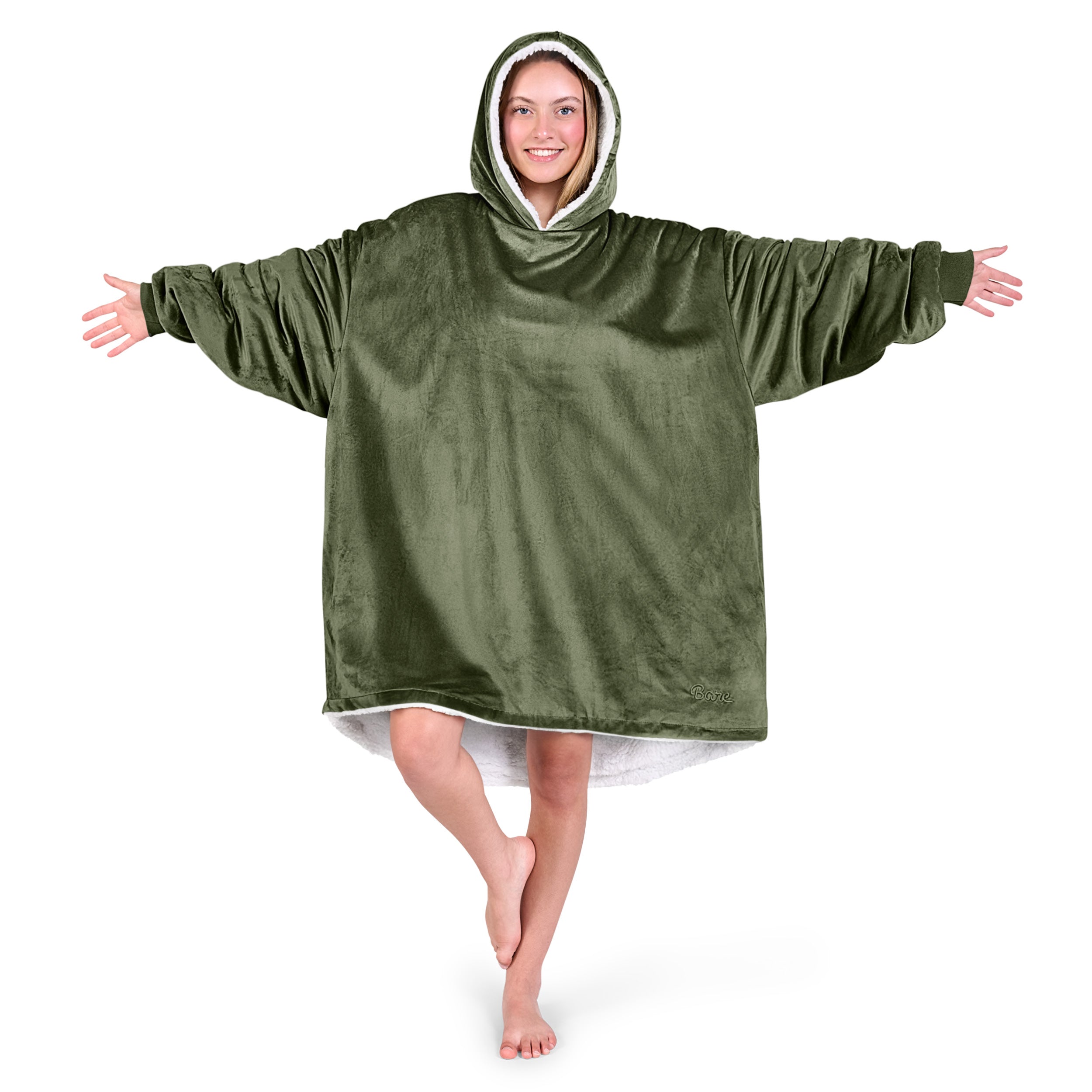 An adult with a sherpa wearable blanket on