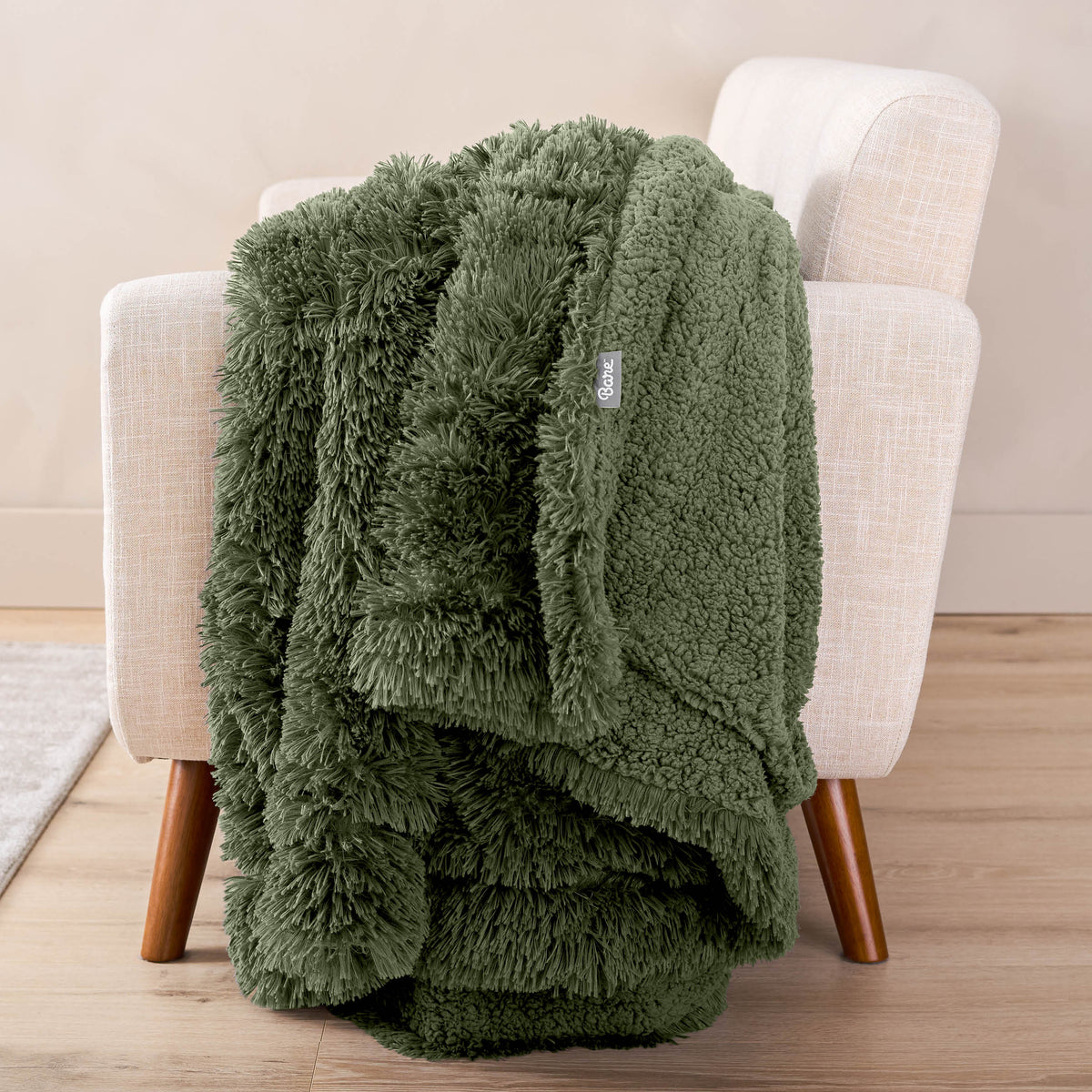 A shaggy blanket draped over the arm of a chair