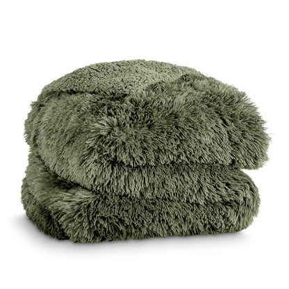 A shaggy faux fur blanket folded neatly