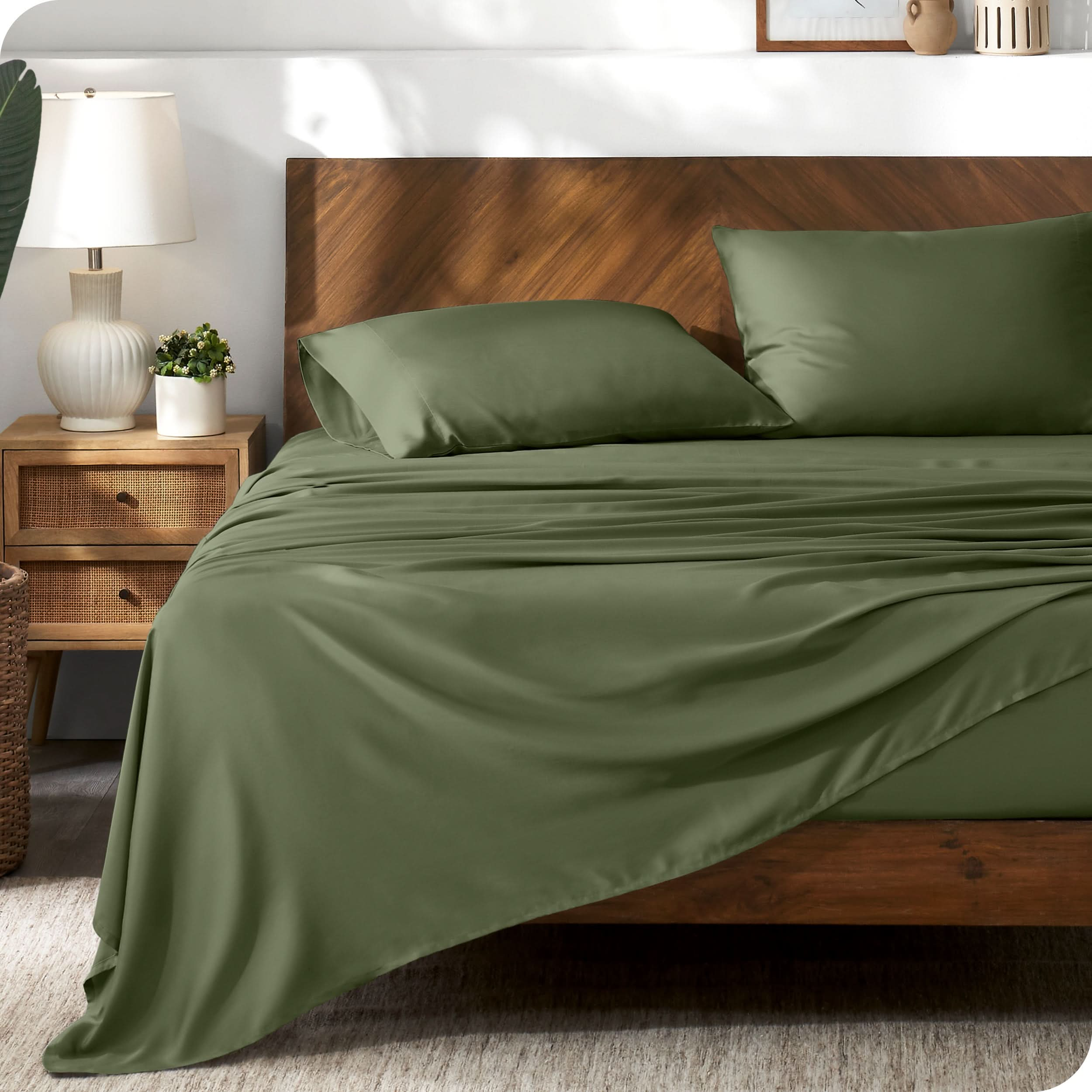 TENCEL™ sheet set on a bed. The flat sheet is draped over the side and end of the bed.