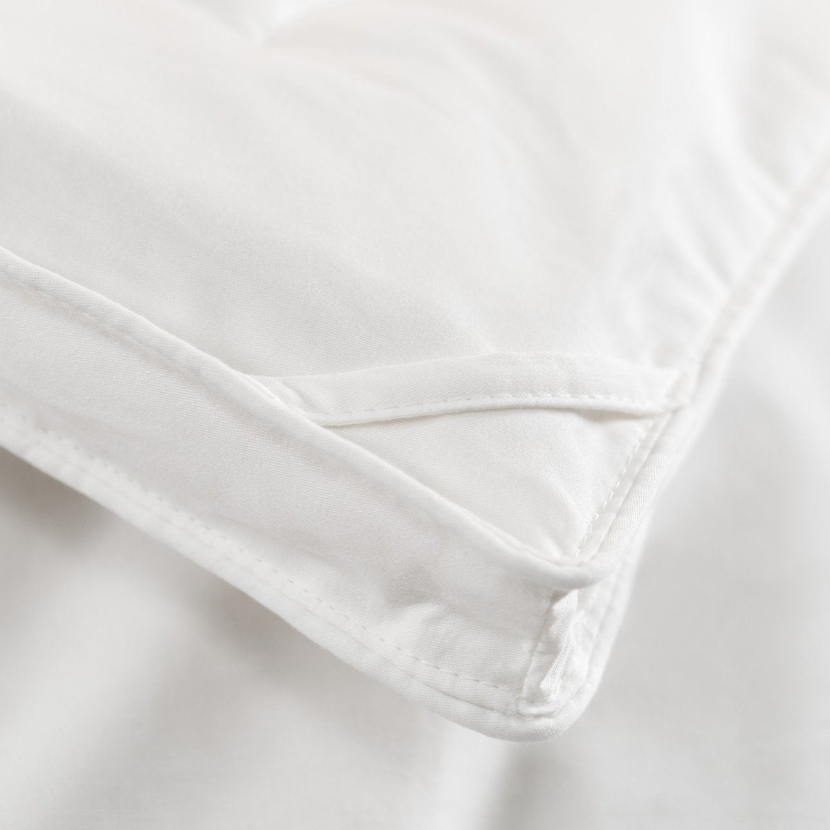 Close-up of the corner of a down comforter
