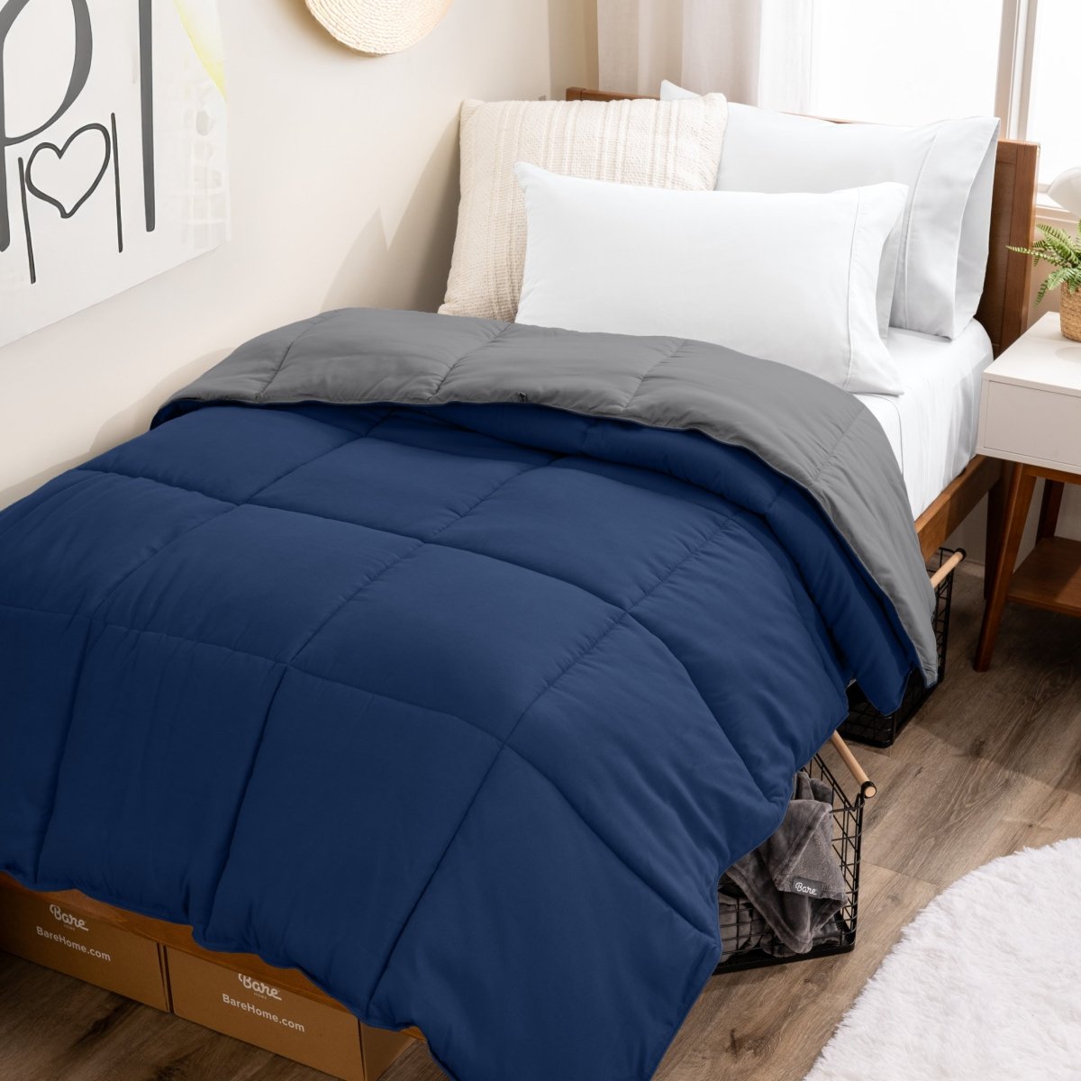 College dorm room with a reversible comforter on the bed