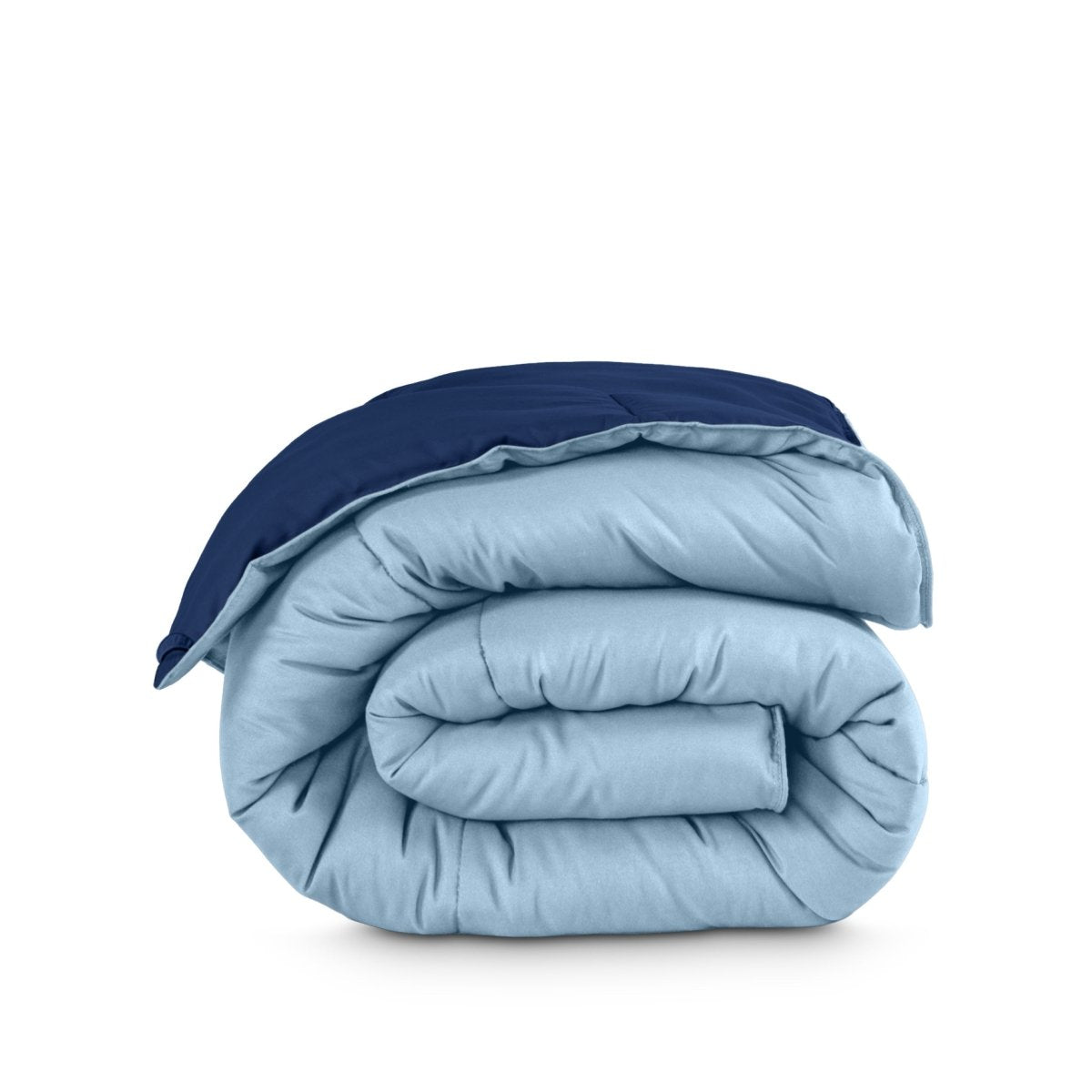 Folded reversible comforter on a white background