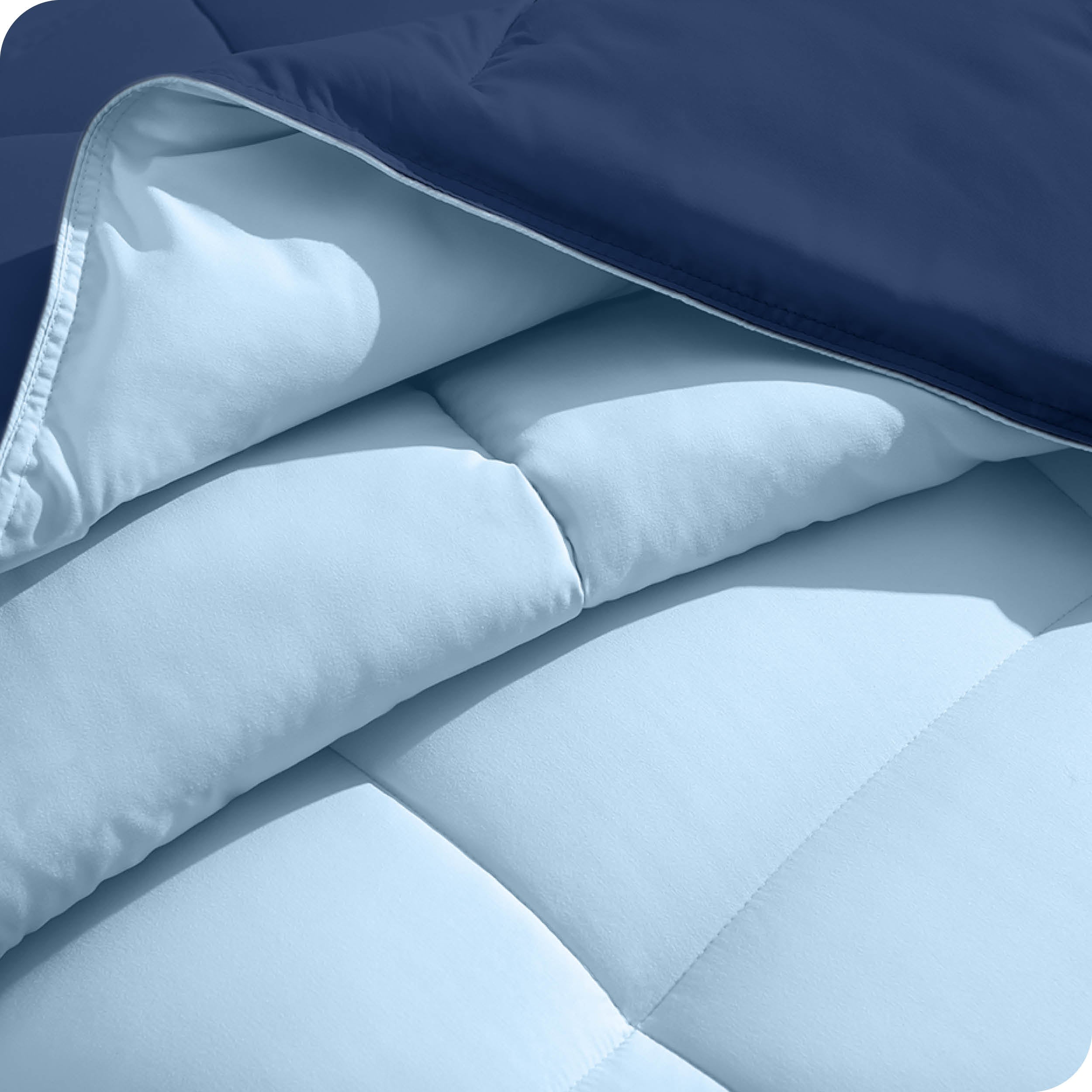 Close up of the comforter folded back showing the two different colored sides