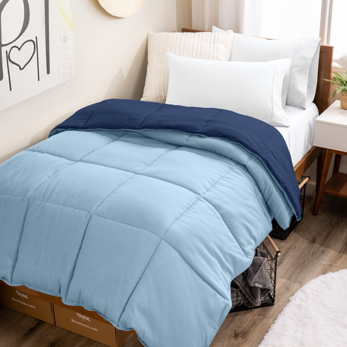 College dorm room with a reversible comforter on the bed