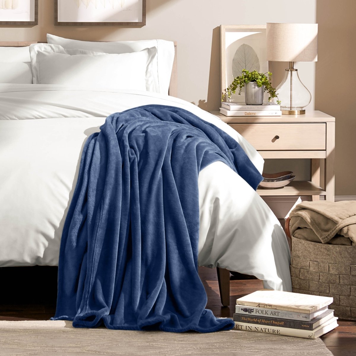 A microplush blanket draped over the corner of a bed
