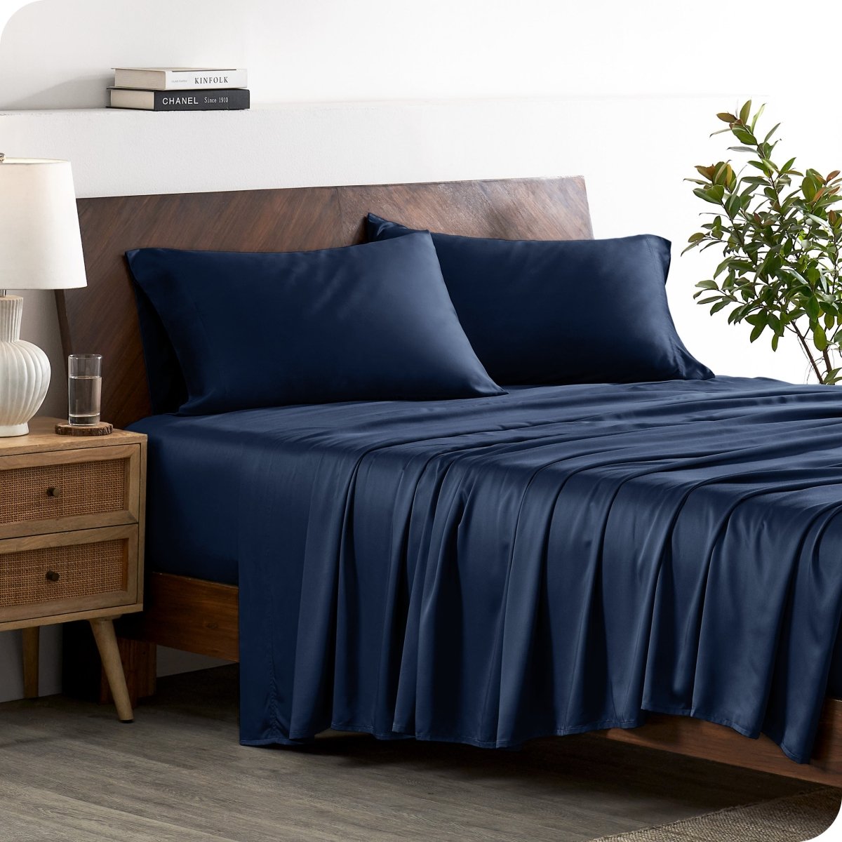 A stylish bed with bamboo sheets and pillowcases, showcasing a sophisticated and elegant bedroom setting.