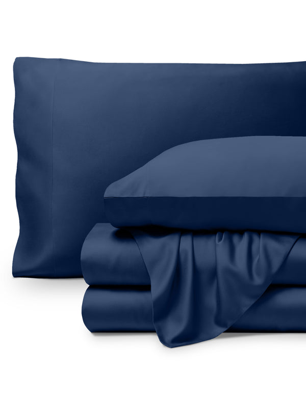 Bamboo pillowcases and sheets set on a white background