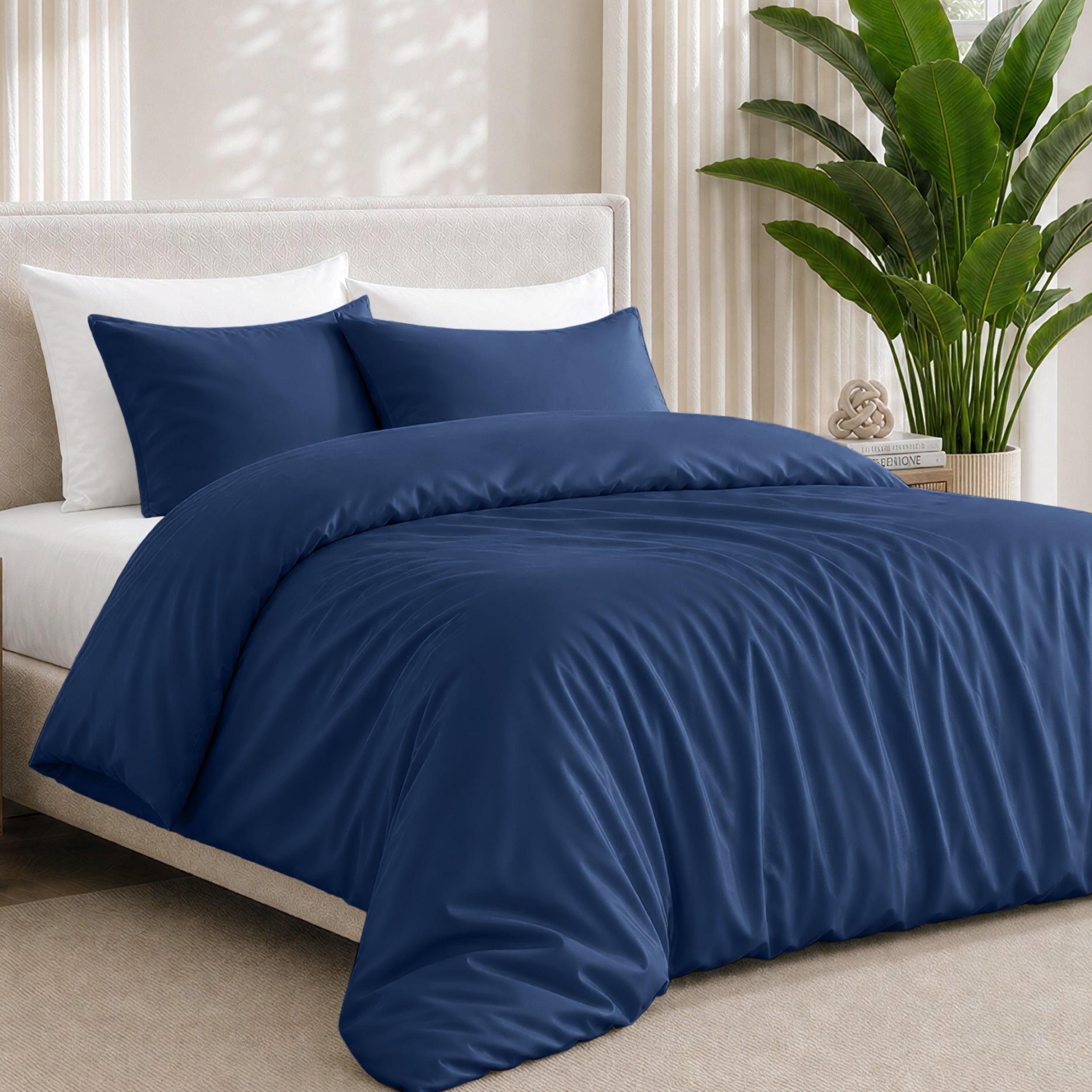 Bamboo bedding set on a bed in a bedroom with a plant in the corner.