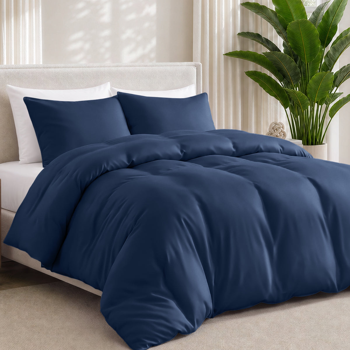 Bamboo bedding set on a bed in a bedroom with a plant in the corner.