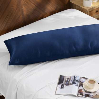 Bamboo pillow on a bed with a magazine and cup of coffee on a wooden nightstand.