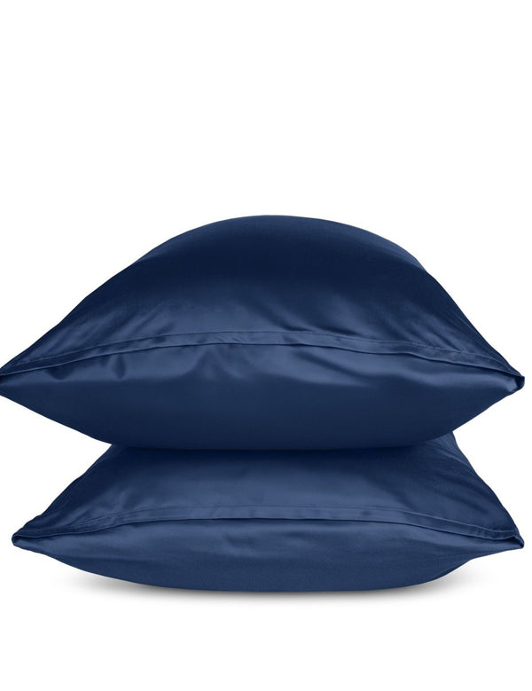 Two blue pillows stacked on a white background