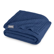 A cotton waffle blanket folded