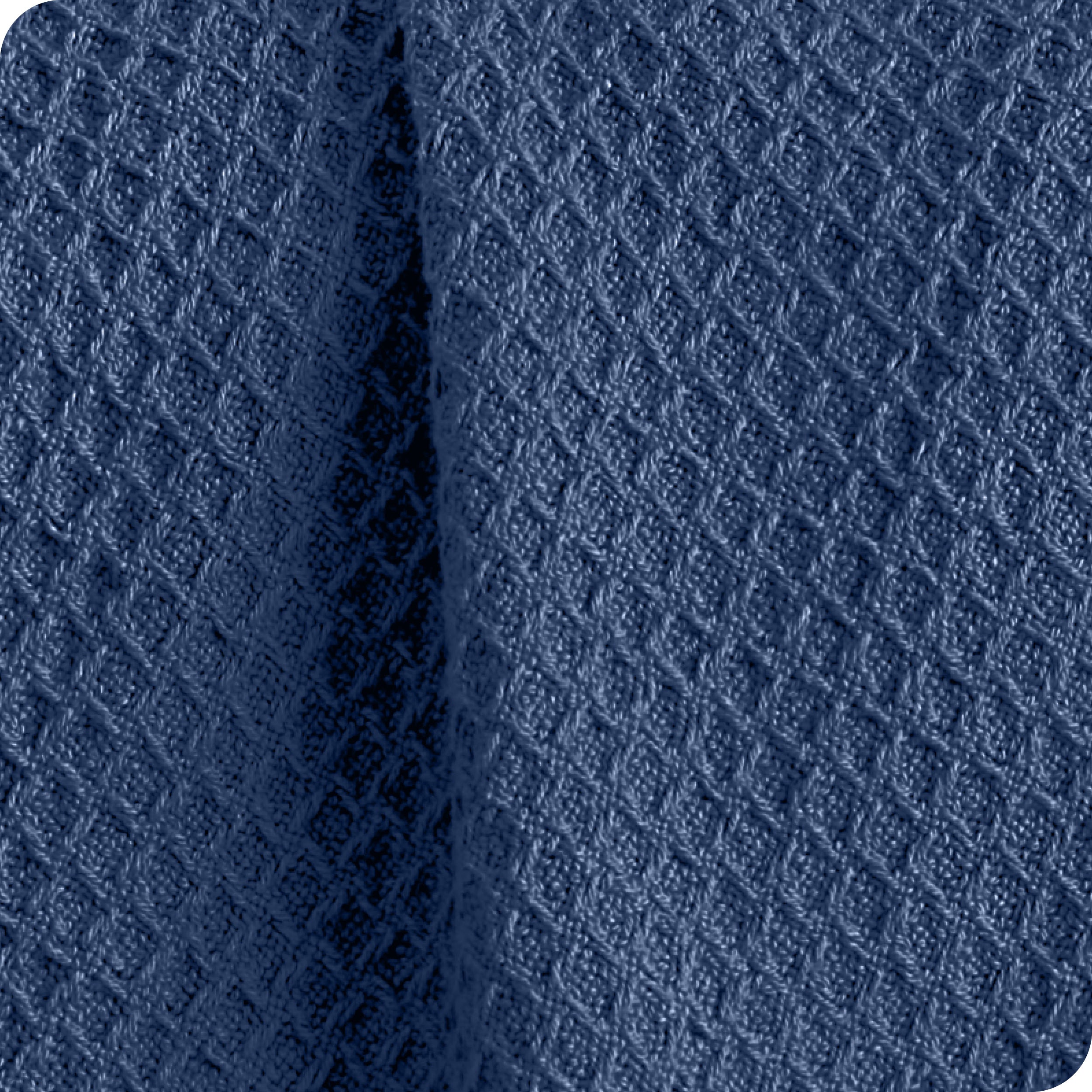 Close up of the fabric of a cotton waffle blanket