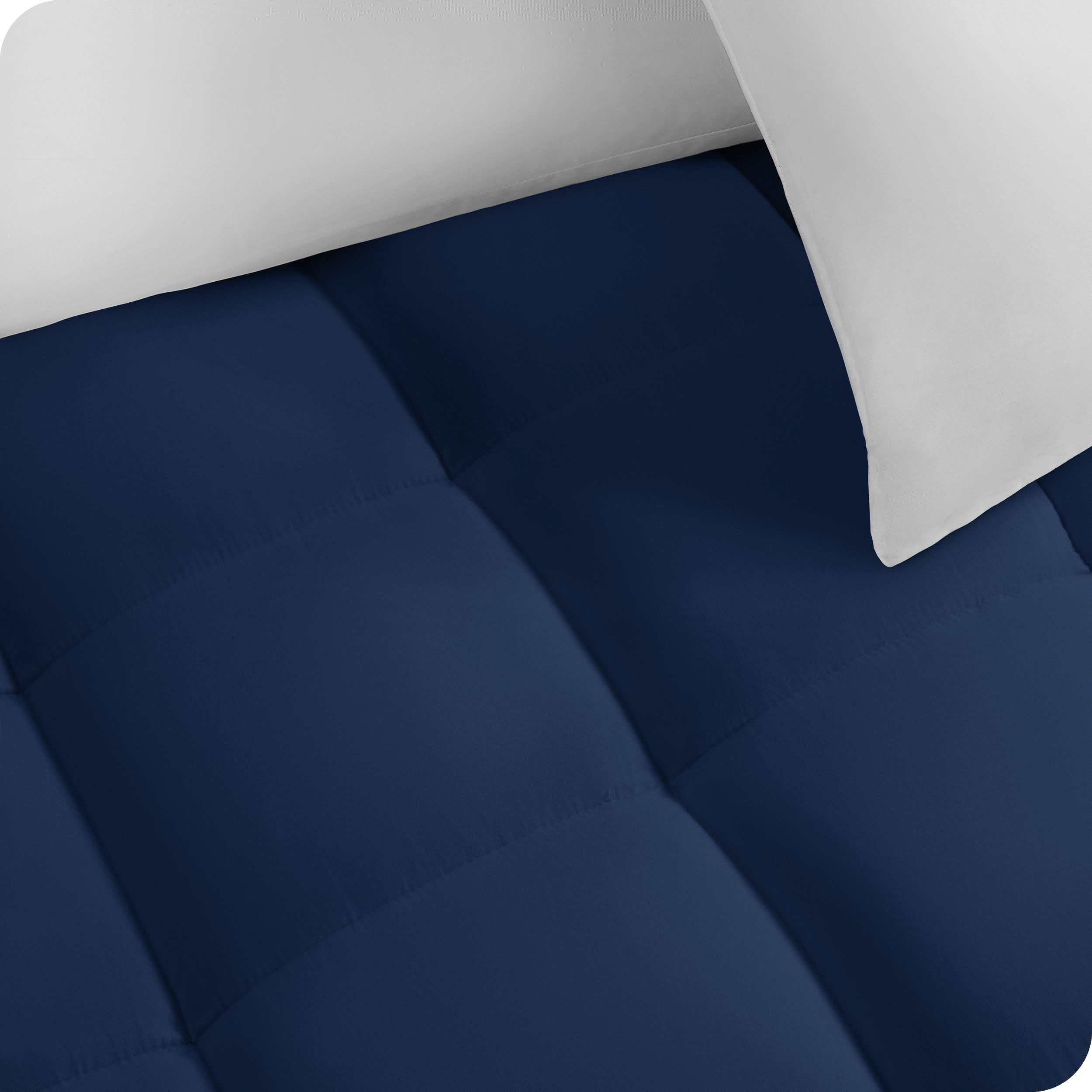 Close up of a cotton mattress pad showing the box-stitching.