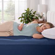 A woman sleeping on a bed