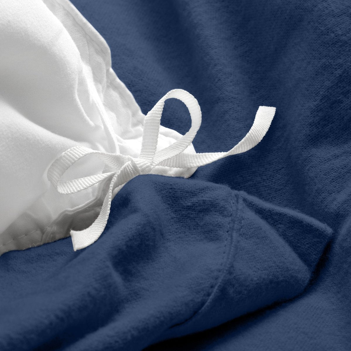Close-up of the ties on a flannel duvet cover