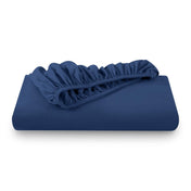 A folded flannel cotton fitted sheet in a white background