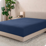 A modern bed with a flannel fitted sheet on