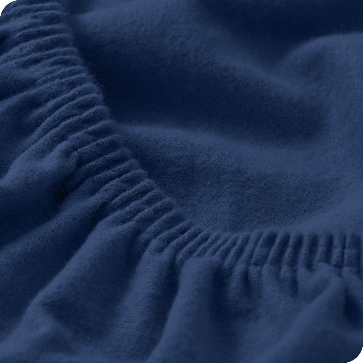 Close up of the elastic portion of a flannel fitted sheet
