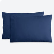 Two pillows with flannel pillowcases on them