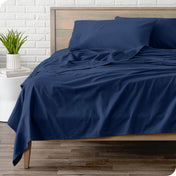 A modern bed with a flannel sheet set on