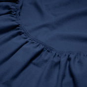 Close-up of a flannel fitted sheet with gathered elastic