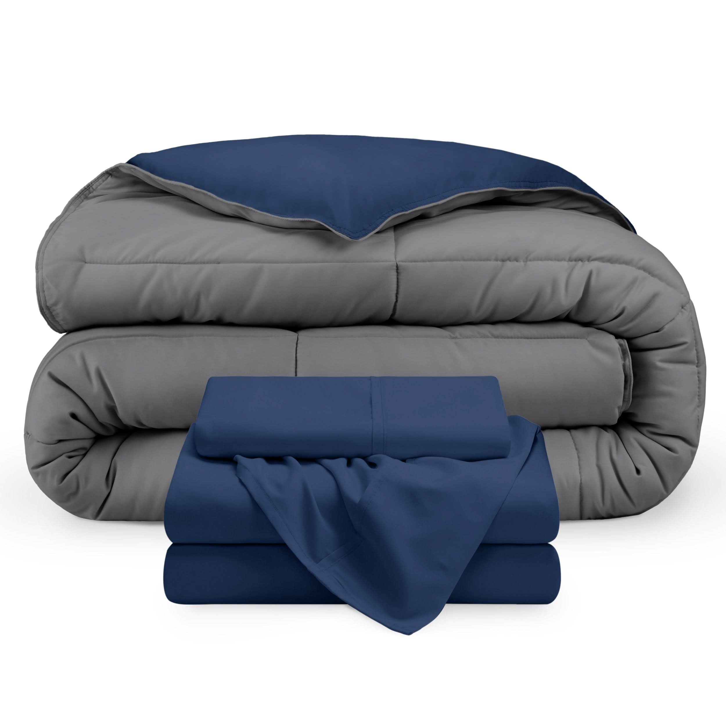 A reversible microfiber comforter and a coordinating sheet set folded and stacked