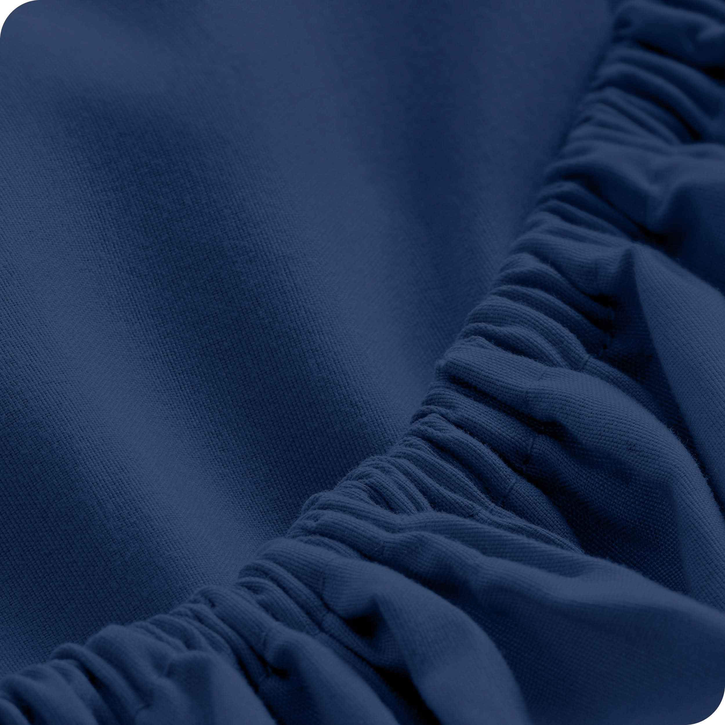 Close up of a fitted sheet with all around elastic