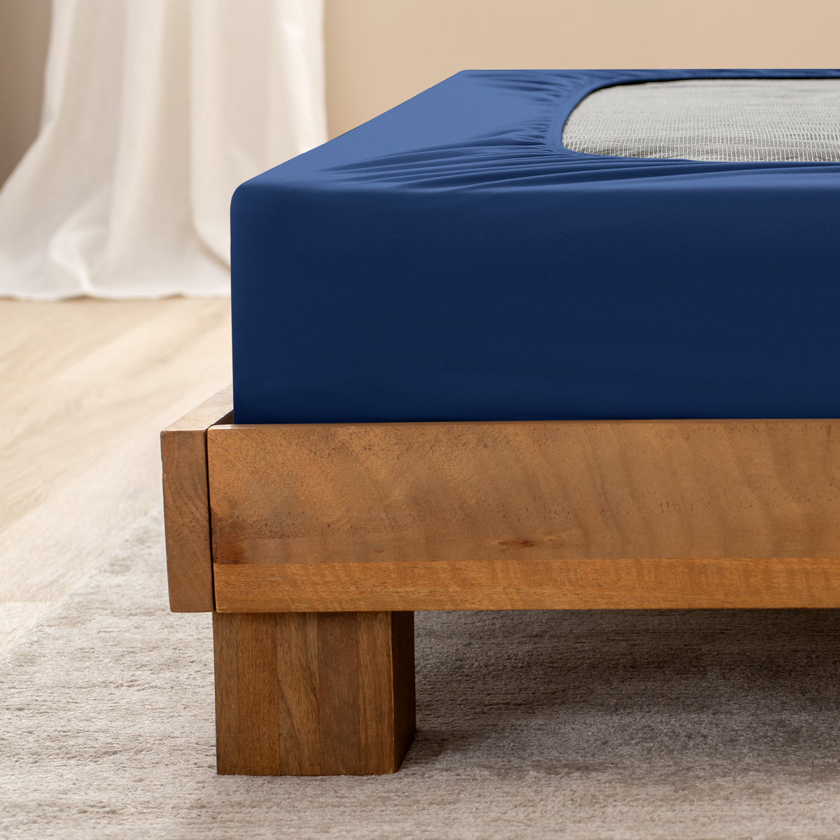 Close up of the corner of a bed frame with a cover box spring 