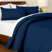 A comforter set on a bed