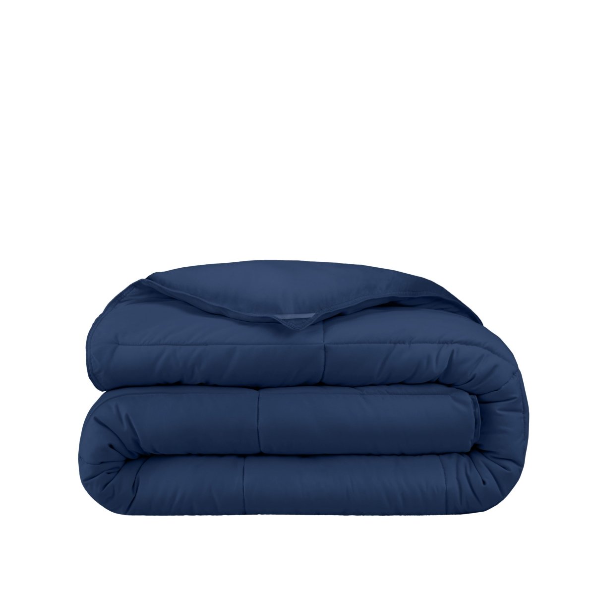 Folded blue comforter on a white background