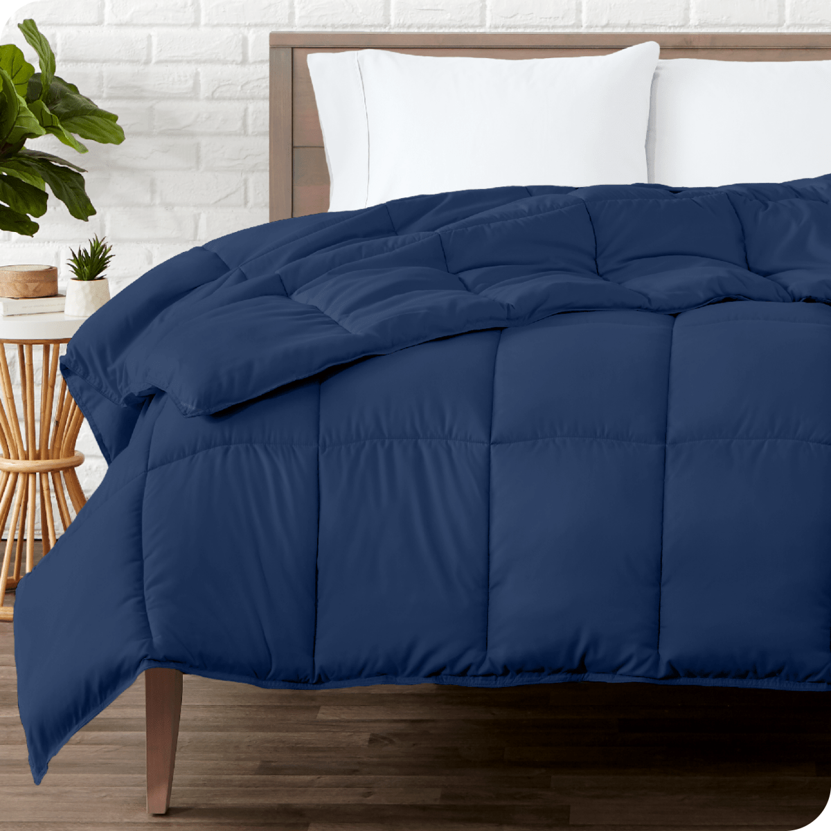 A modern bedroom with a duvet insert on a bed folded back over itself