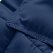 A close up of a corner of the microfiber comforter