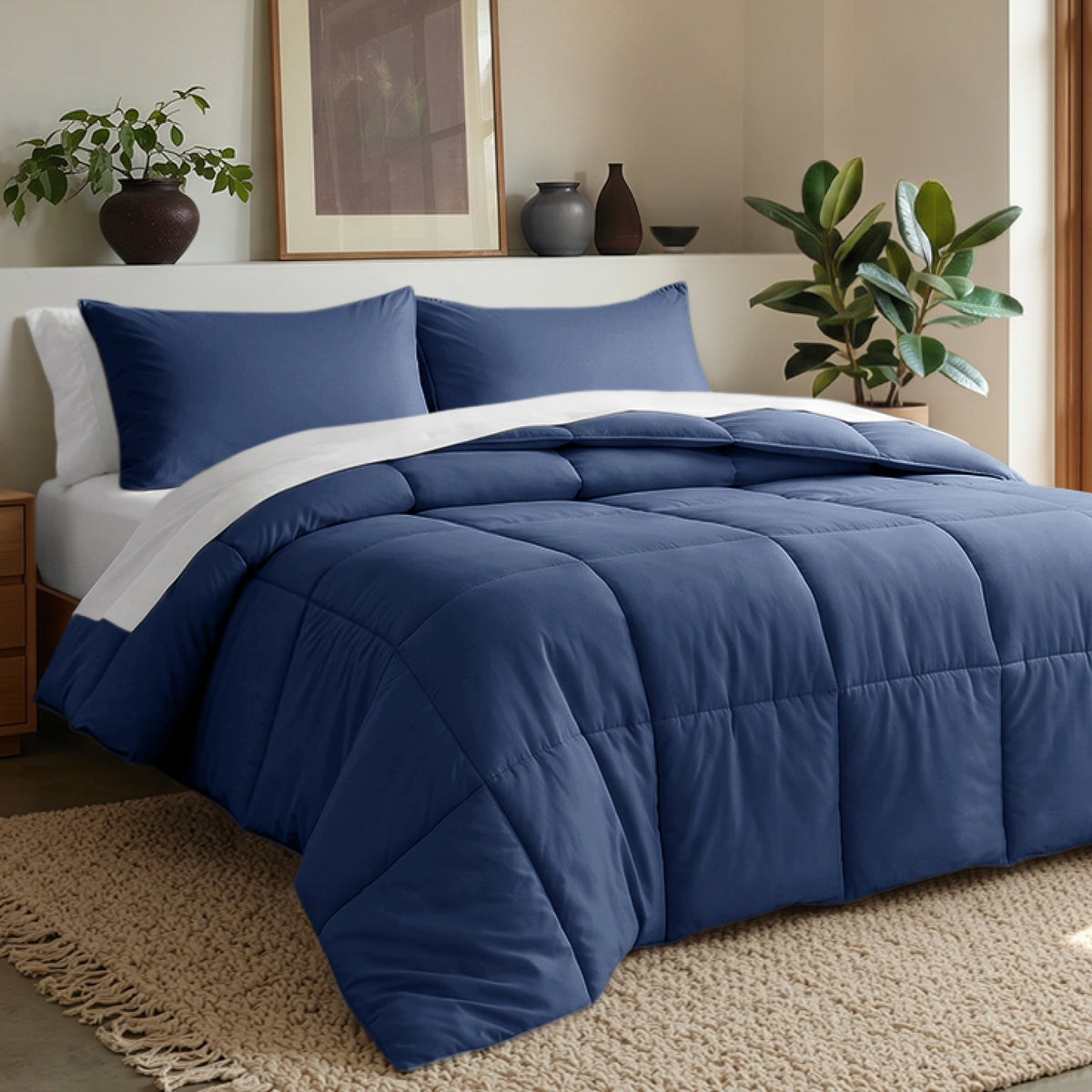 Comforter set on a bed in a bedroom with plants and decor.