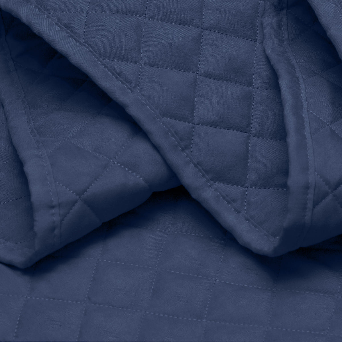 Close in view showing texture of coverlet set fabric