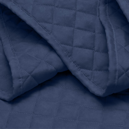 Close in view showing texture of coverlet set fabric