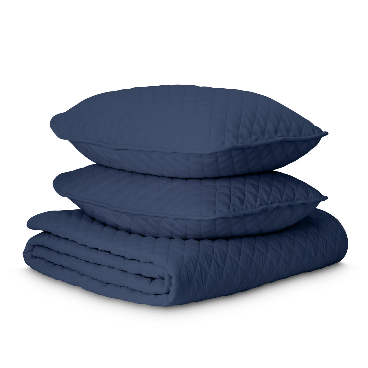 Microfiber quilt with matching pillow shams stacked on top