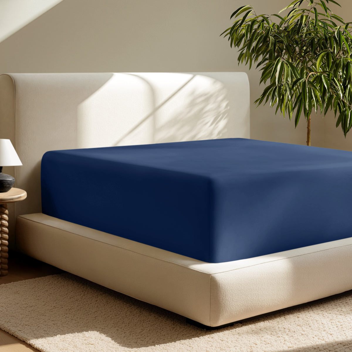 A deep pocket fitted sheet on a mattress