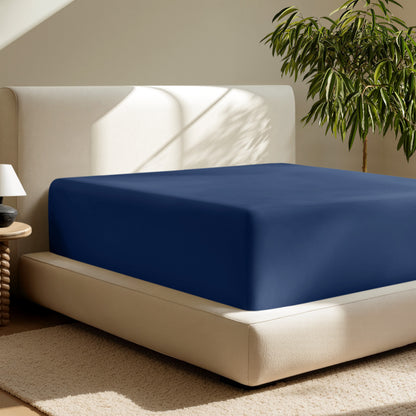 A deep pocket fitted sheet on a mattress