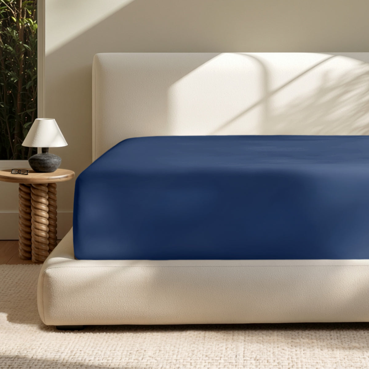 A deep pocket mattress with a fitted sheet on it