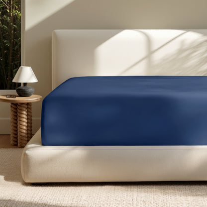 A deep pocket mattress with a fitted sheet on it