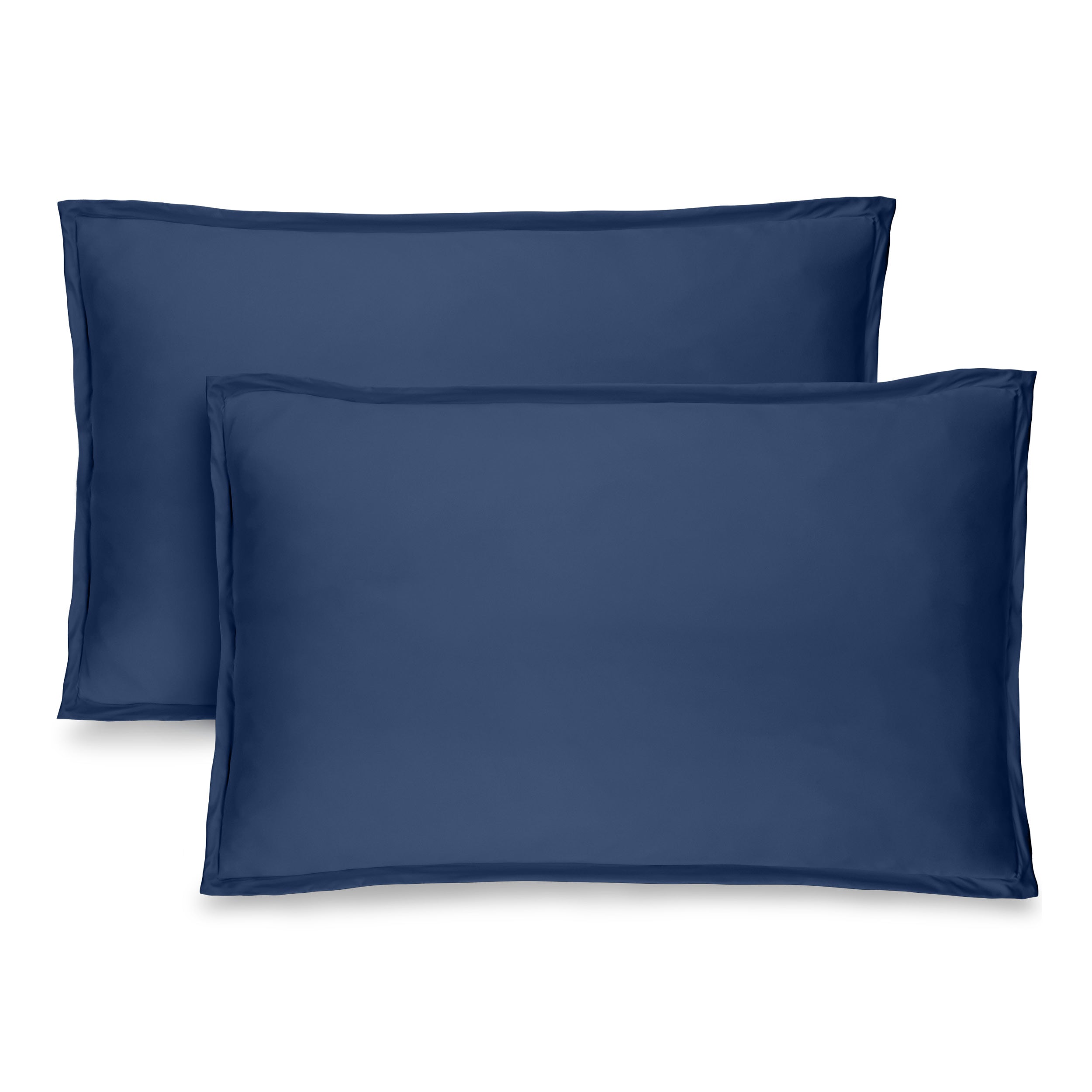Two dark blue pillow shams on pillows standing up with one behind the other