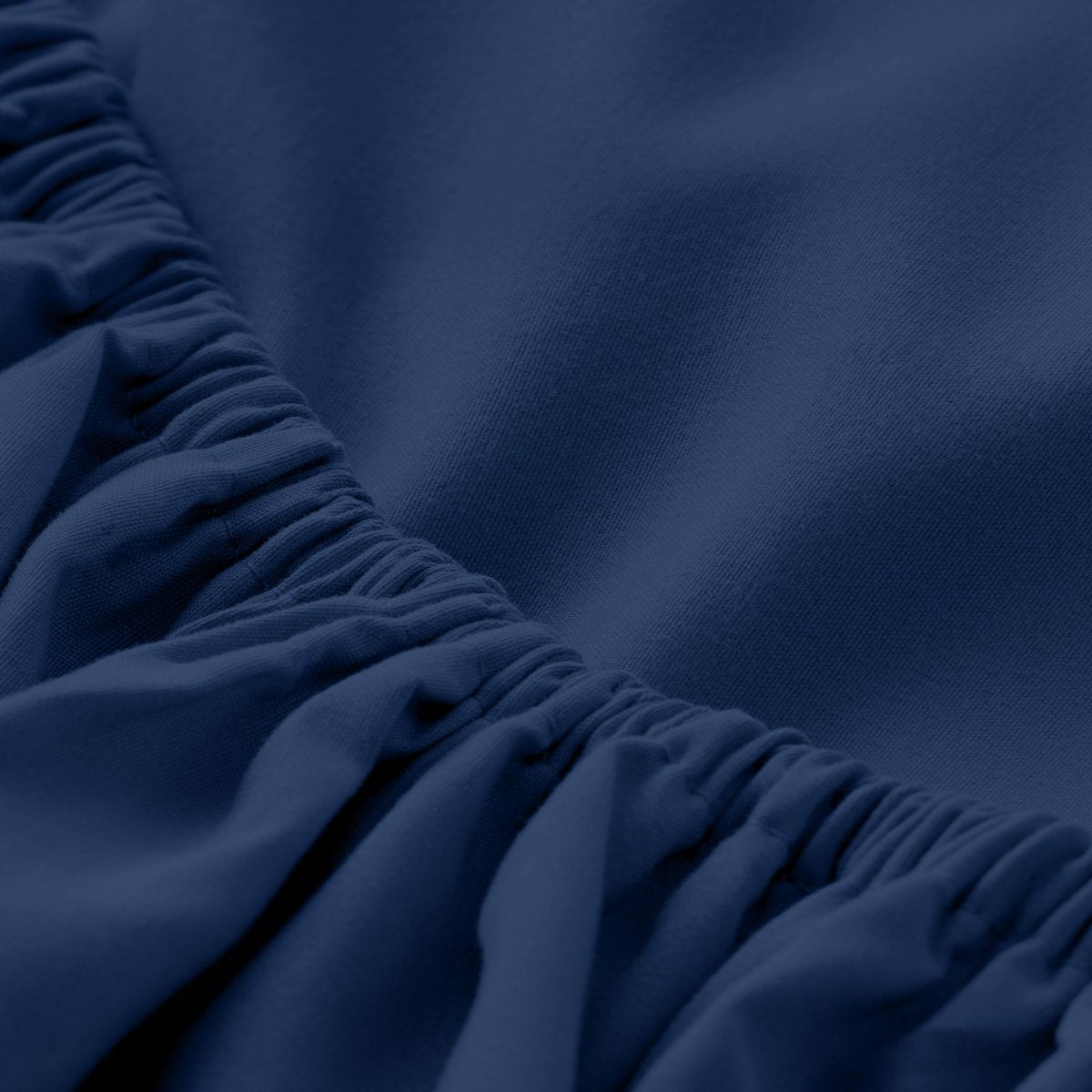 Close-up of elastic on a fitted sheet.
