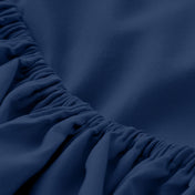 Close-up of elastic on a fitted sheet.