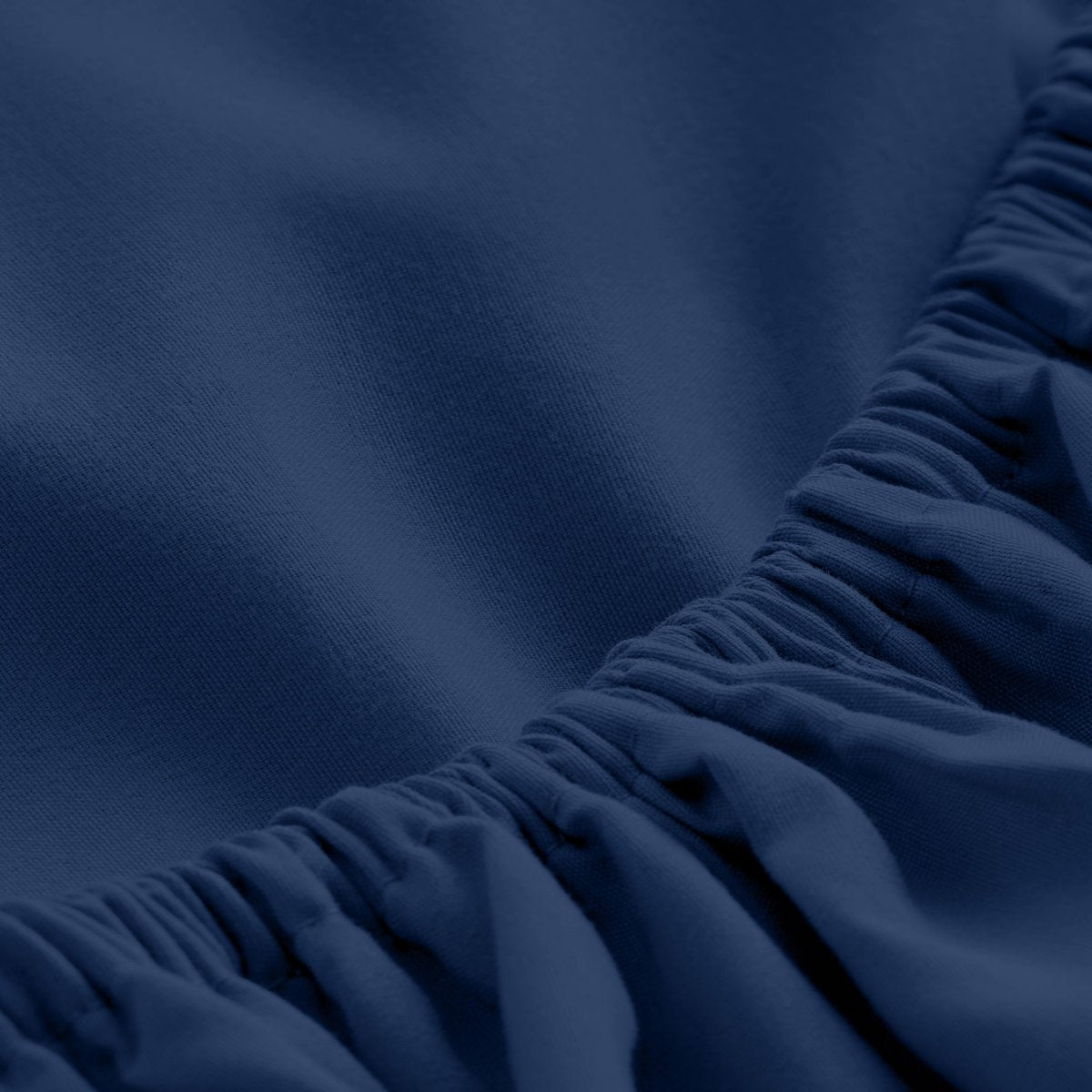 Close-up of fitted sheet showing the all around elastic