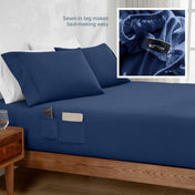 Bed sheet with sewn-in tags on a bed, with an inset showing a close-up of the tag.