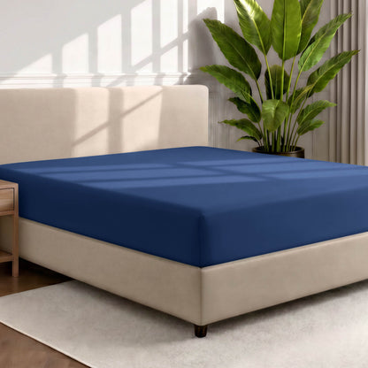 Ultra soft fitted sheet on a mattress with the sun shining into the bedroom